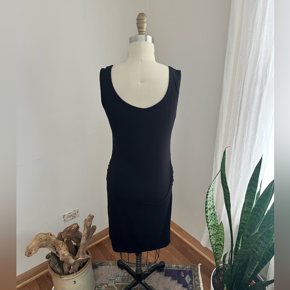 Black form fitting dress, Size M, great condition.